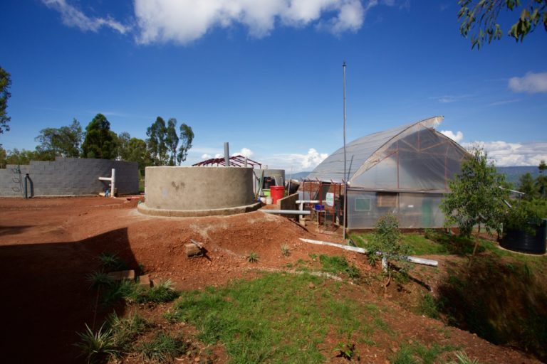 From left to right, the fecal sludge receiving tank, flocculation tanks, and mechanical dewatering system at the Pivot Works plant.