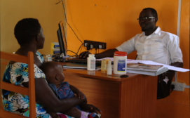 Mother brought child for check-up and immunization, with the nurse at Okita Community Health Centre