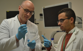 Dr. Vincent Biron (left) and Dr. Andre Isaac (right) collecting cervical swab samples for ddPCR testing. Photo Credit Caroline Jeffery.