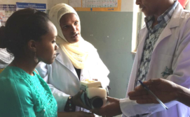 Doctors and nurses at a rural clinic in Ethiopia review an early prototype of the SubQ Assist to provide design feedback
