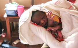 The Shanti Uganda Society - Newborn baby recently born at the Shanti Uganda Birth House. Photo credit John Suhar