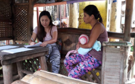 Project coordinator interviewing a new mom - Photo Credit - Ding Zafe