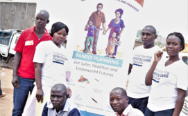 Global Health Economics Ltd - Project staff and trained community health workers on the day of program launch in the Kifumbira slum community, Kampala, Uganda.